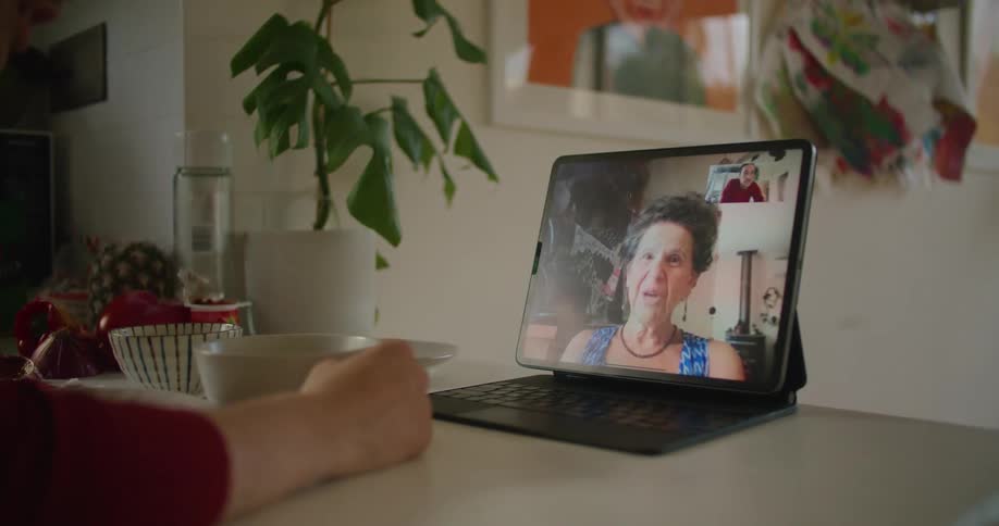 Person talking on laptop