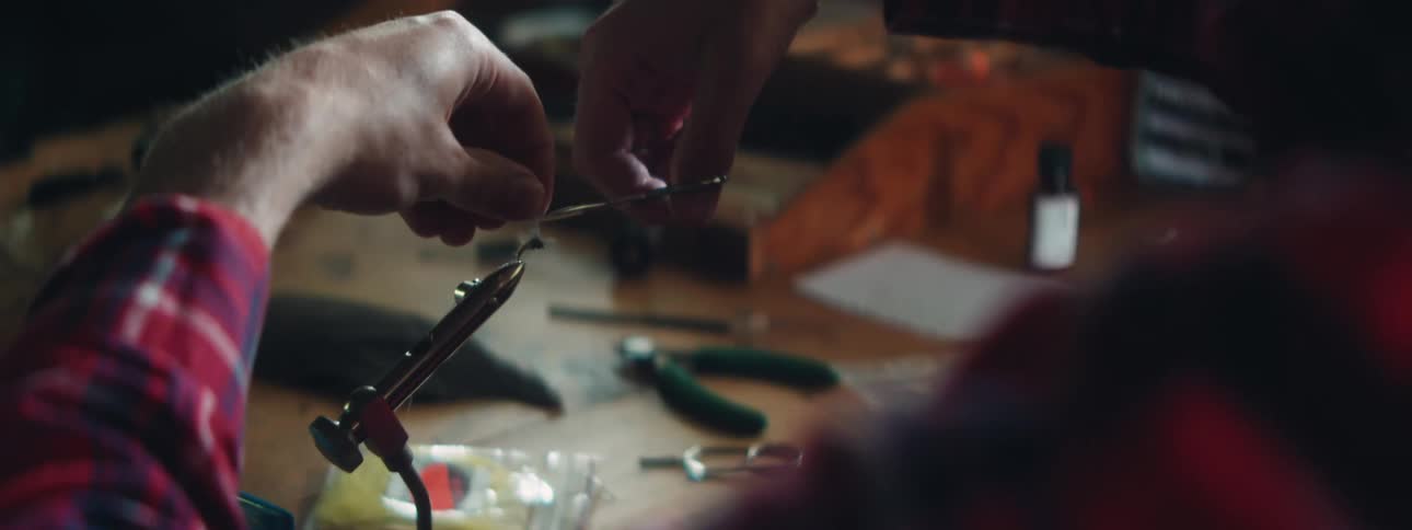 A person working on fixing gears