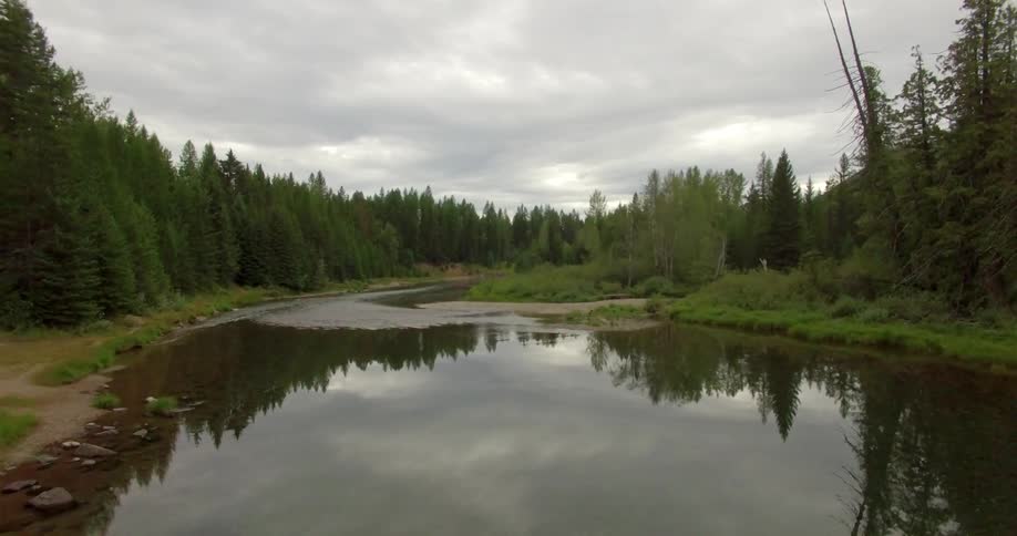 Moving over a small body of water on a cloudy day