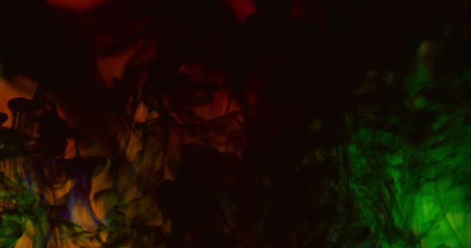 A green dye expands faster than red and blue dyes as they mingle and combine in a clear liquid