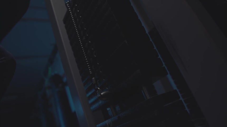 Close up of weights lifting on a machine