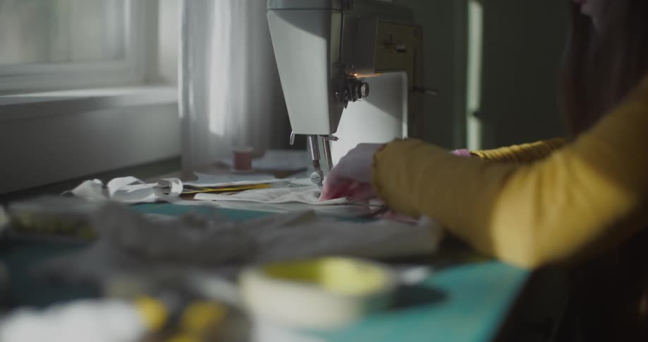 A woman using a sewing machine