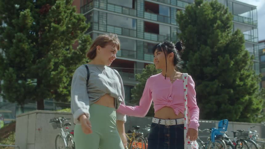 Two women hugging each other outdoors