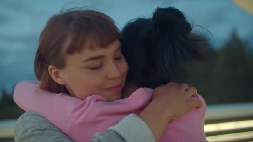 Woman hugging each other