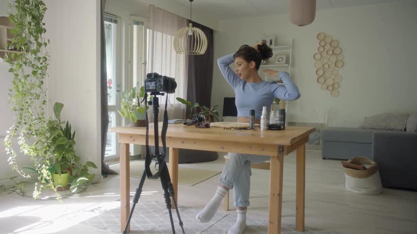 A woman is filming herself talking