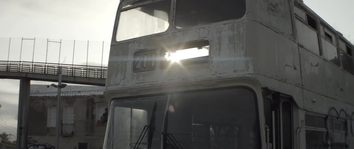 Moving around an empty bus near an overpass