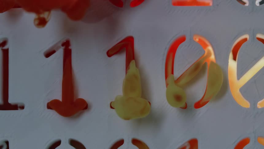 Orange and yellow liquid flows through number cutouts in white background