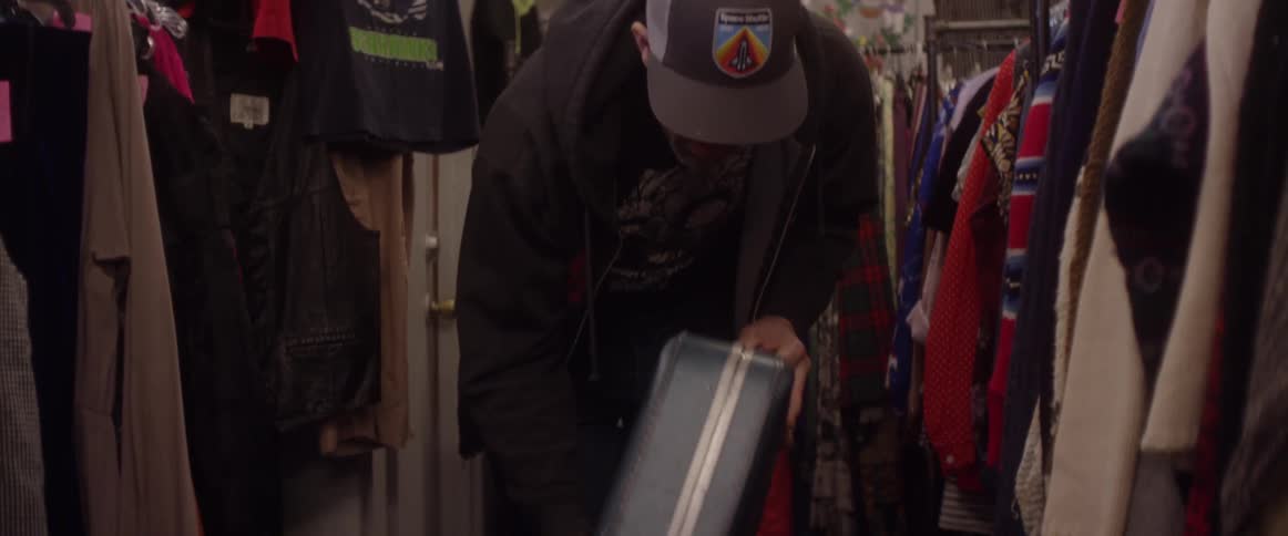 A man puts down a suitcase