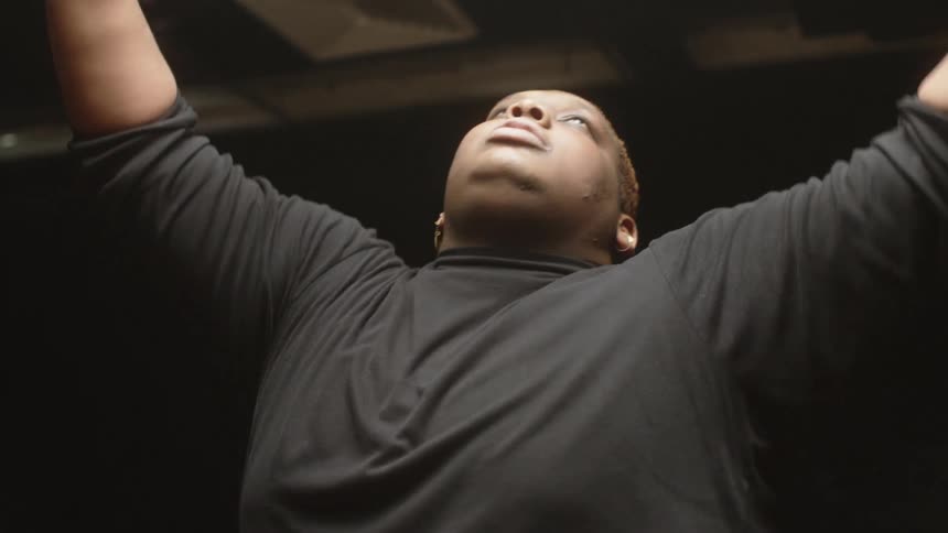 A man is dancing and spinning around