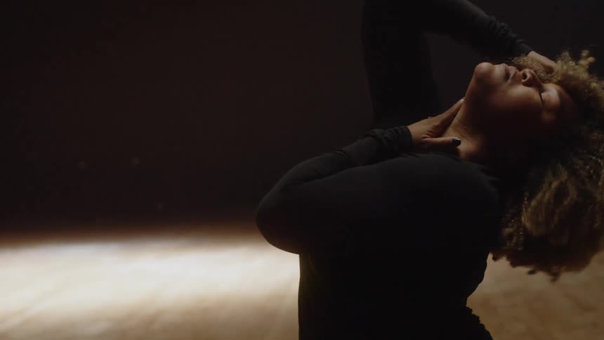 A woman dancing in a studio