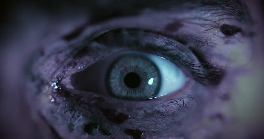 A persons eye focuses as they blink