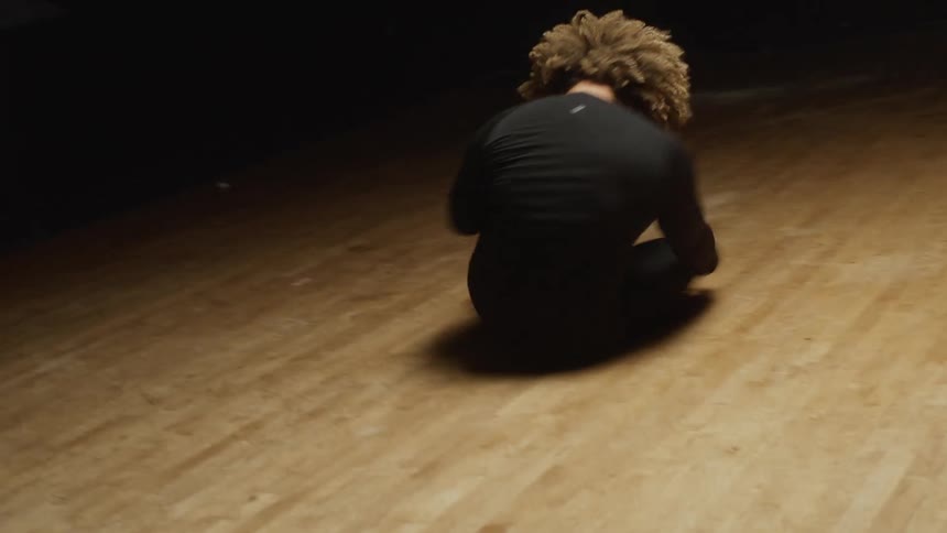 A woman chaotically dancing