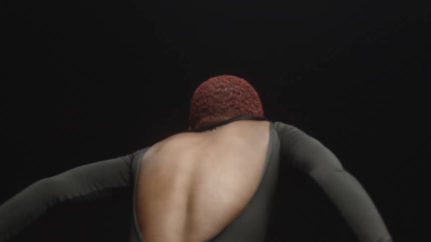 A woman dancing in a studio