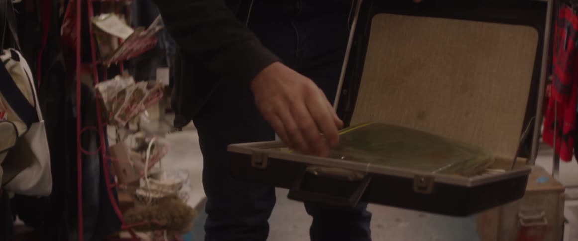 A man opens a briefcase