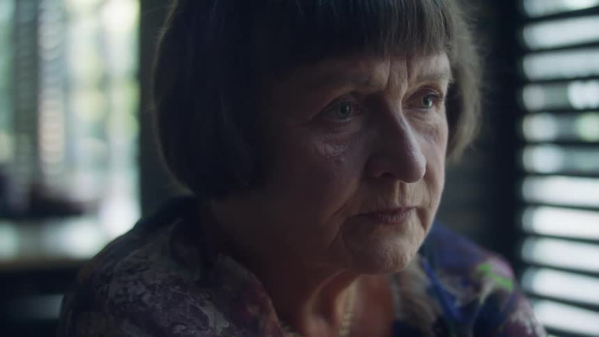A woman is nodding her head and talking