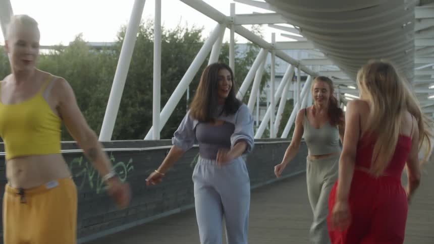 People dancing on bridge