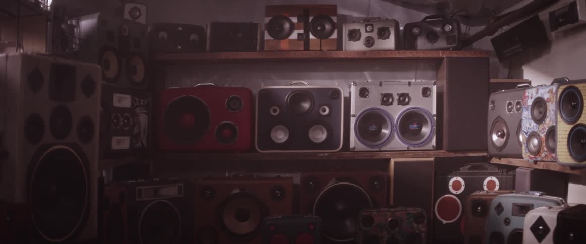 A wall of suitcase speakers
