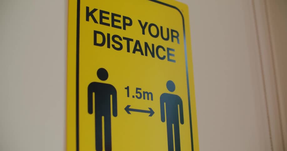 A room with a door with a sign
