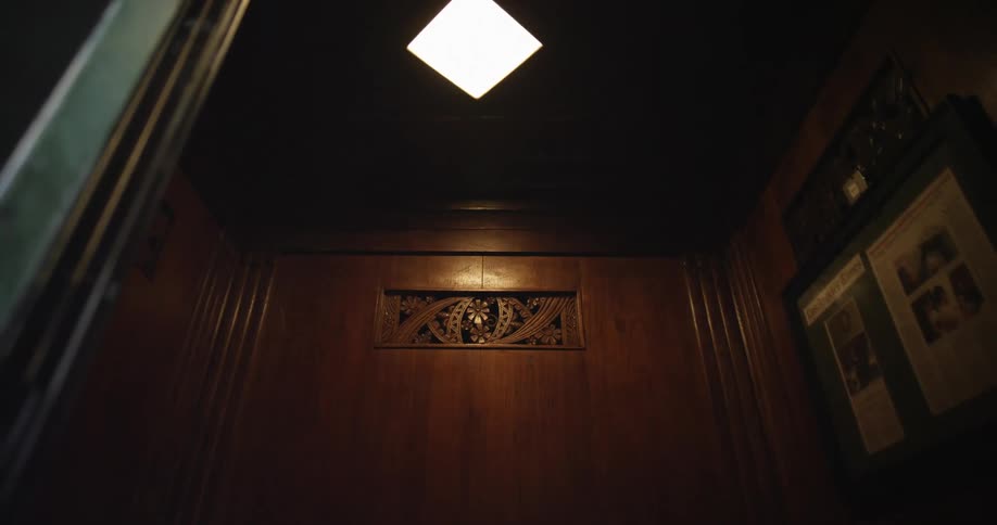 A tight room with a wooden wall