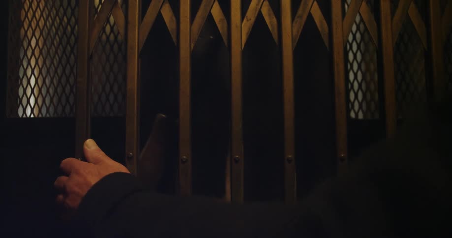 The elevator goes down and someone opens the door