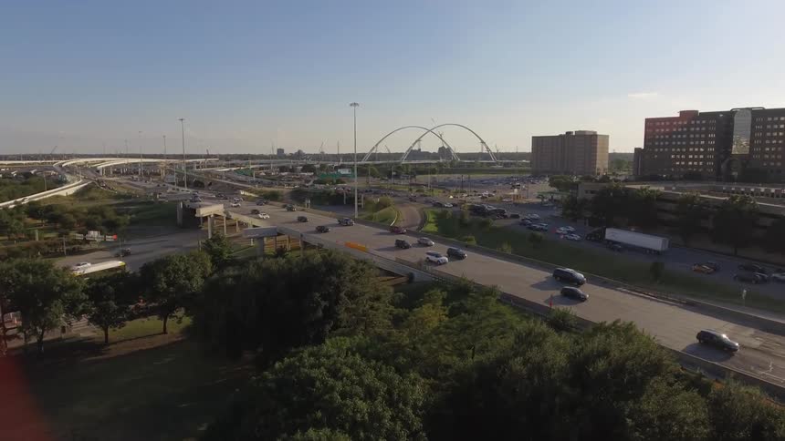 Time lapse of vehicles traveling on roads on a sunny day