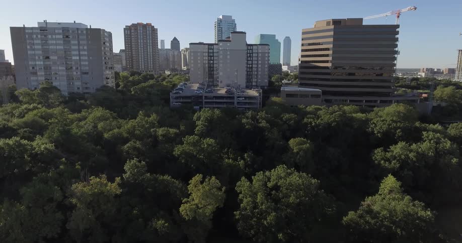 Moving over a forest towards a city