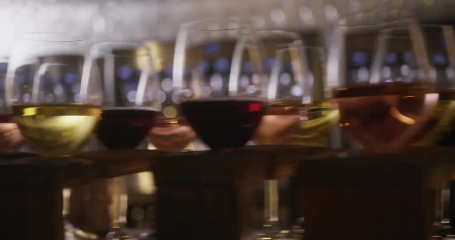 The bar is filled with glasses of wine