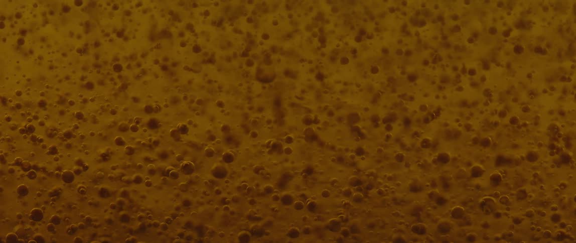Bubbles form against a yellow background