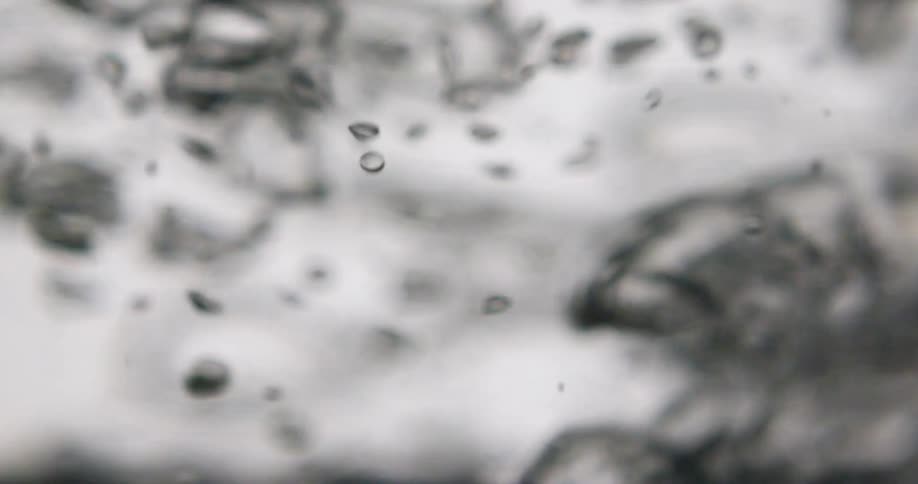 Bubbles move around vigorously in liquid