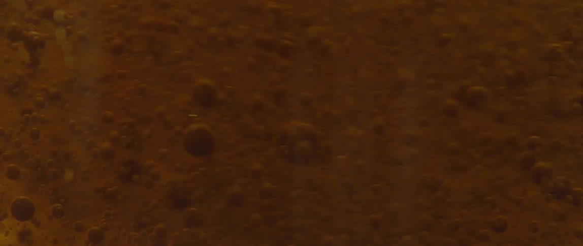 Small bubbles stir in liquid