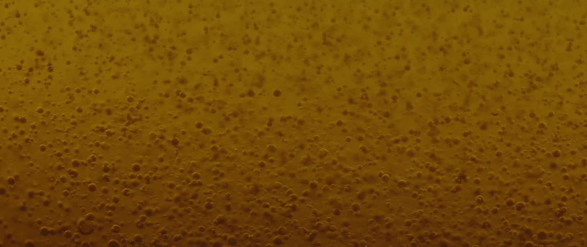 Bubbles form against a yellow background
