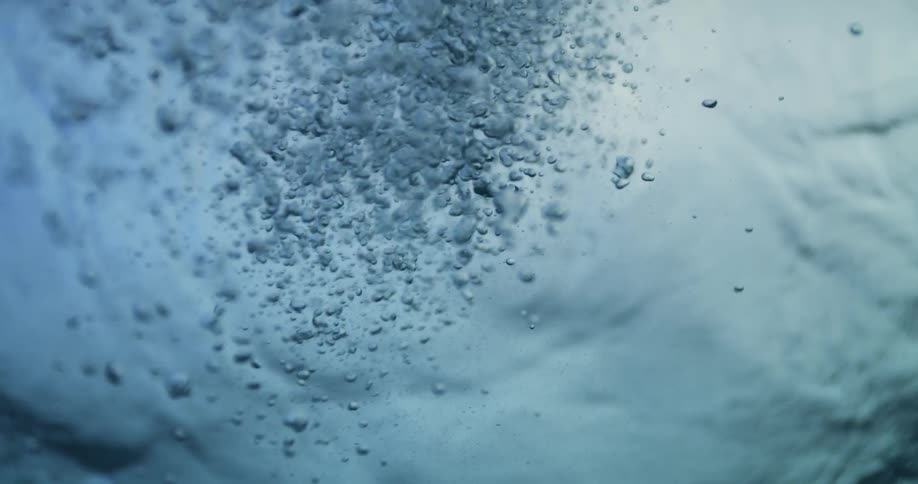 Under water footage of bubbles rising to the surface