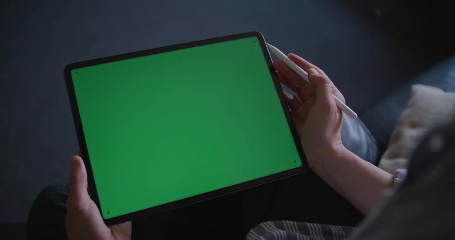 Man using a tablet with a green replaceable screen
