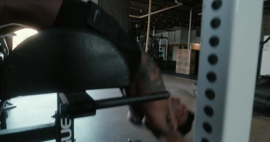 A man does an ab workout off a weight bench