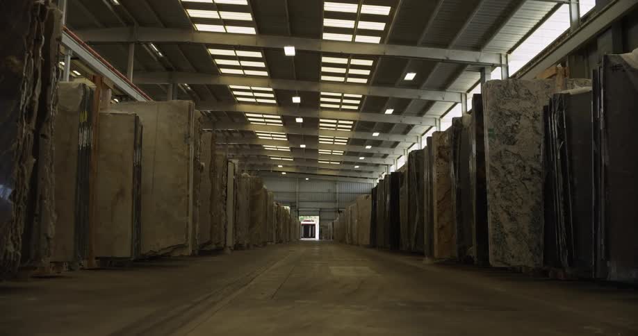 Slabs of marble and stone stored inside a warehouse