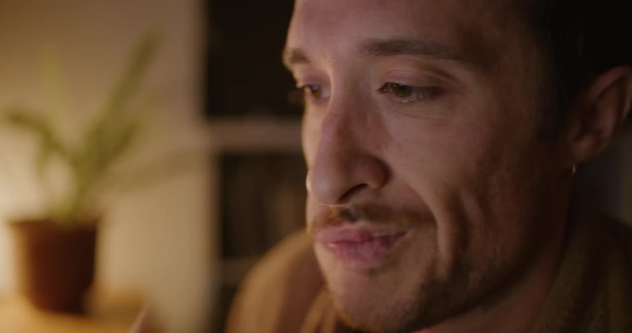 A man sitting in a room thinking