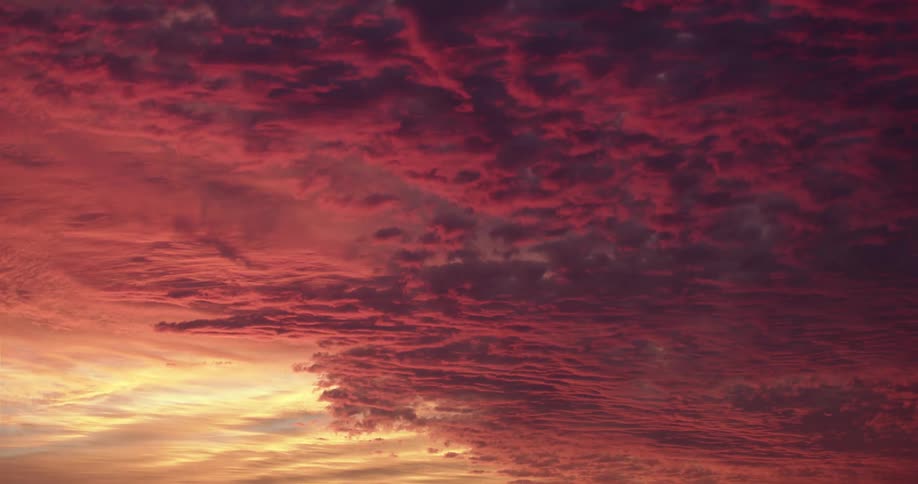 Thick red cloud cover with golden sunlight