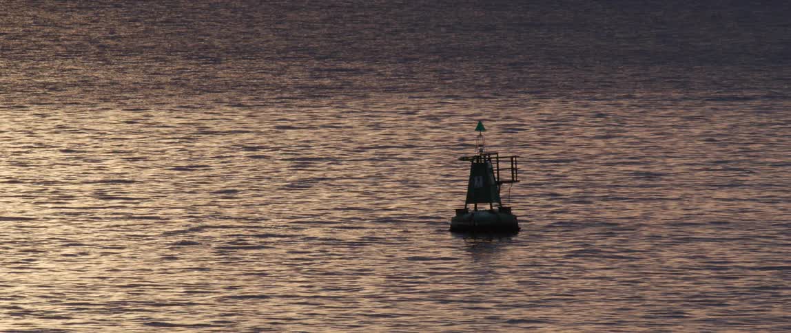 Ocean water flowing around a buoy