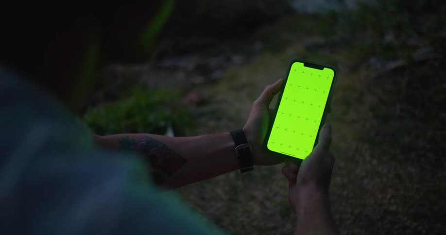 A person using a smartphone outdoors