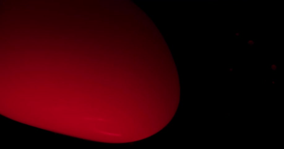 Red blobs shaped like orbs move and change shape
