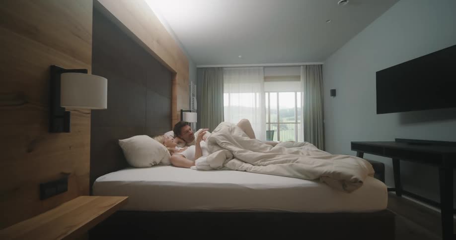 A couple laying in bed