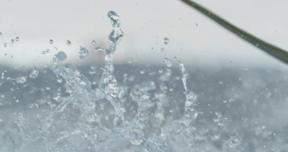 Water falling on the ground in slow motion
