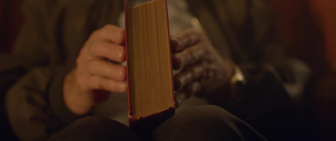 A man closes a book