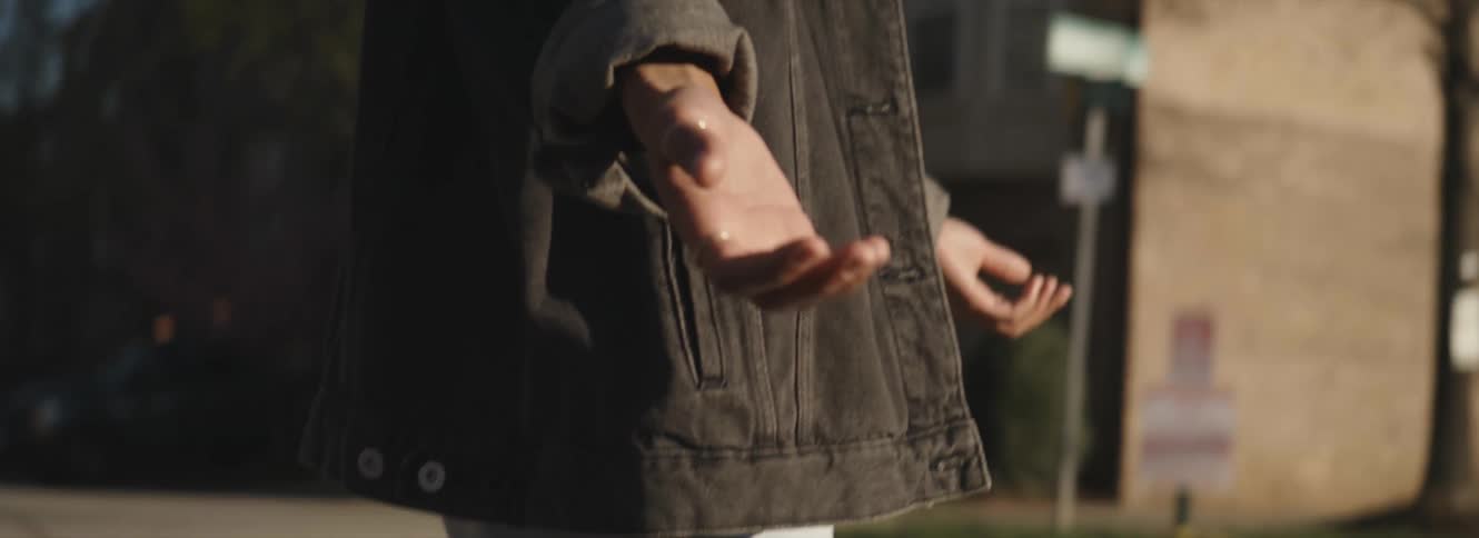A person holding their hands out like they are waiting for rain