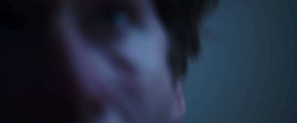 A man shakes his head as he screams in terror and pain