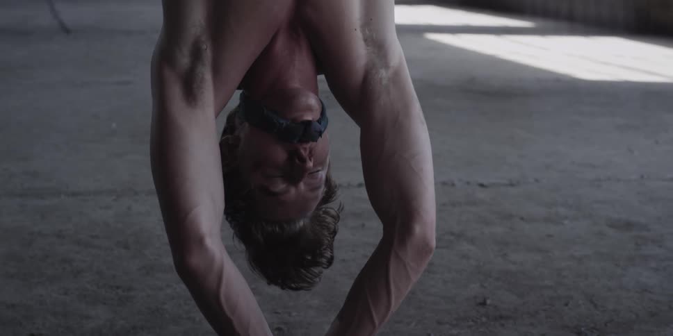 A man is hung upside down struggling