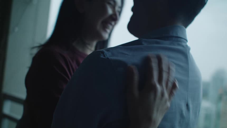 People hugging indoors