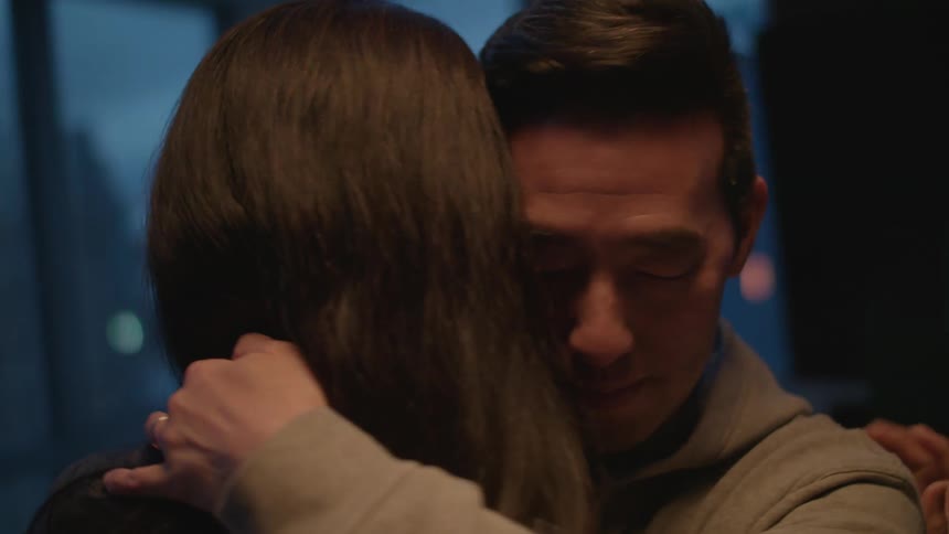 Person hugging another