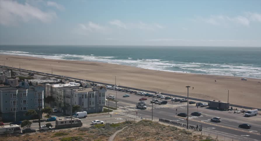 A view of the beach and a road next to it