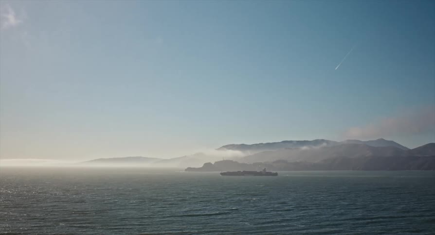 A large ship travels in the ocean